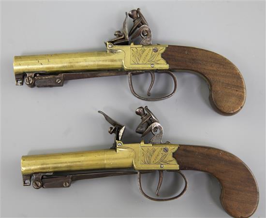 A pair of brass framed and barrelled flintlock boxlock pocket pistols, 8in. (11in with bayonet)